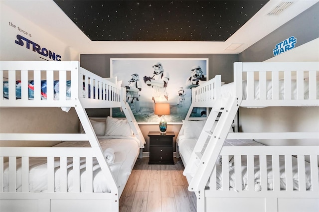 bedroom featuring wood finished floors