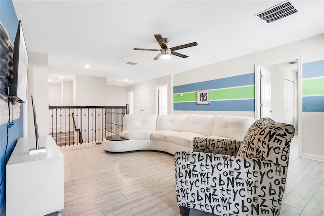 living room featuring a ceiling fan, wood finished floors, and recessed lighting