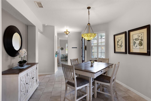 532 Casanova Ct, Kissimmee, FL 34759 - dining area with baseboards and light tile patterned floors