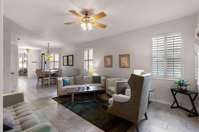 532 Casanova Ct, Kissimmee, FL 34759 - living room featuring a ceiling fan and baseboards