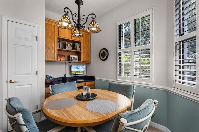532 Casanova Ct, Kissimmee, FL 34759 - dining area featuring healthy amount of natural light, baseboards, and a chandelier