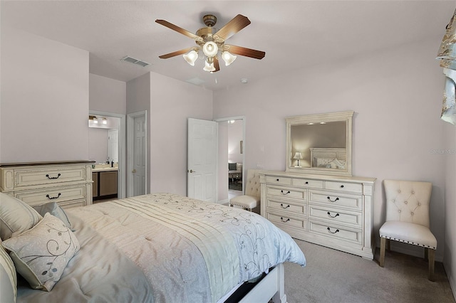 532 Casanova Ct, Kissimmee, FL 34759 - bedroom with light colored carpet, ensuite bath, and ceiling fan