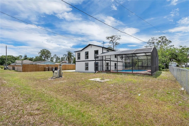 1840 Lillian Dr, Saint Cloud, FL 34771 - rear view of house with a lanai