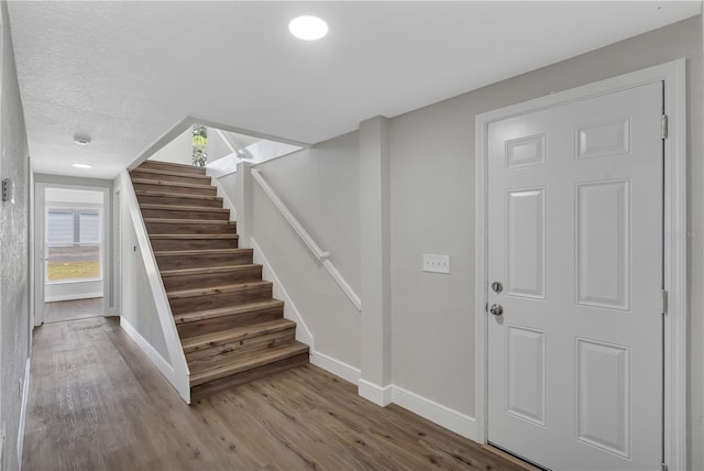 1840 Lillian Dr, Saint Cloud, FL 34771 - stairway with baseboards and wood finished floors