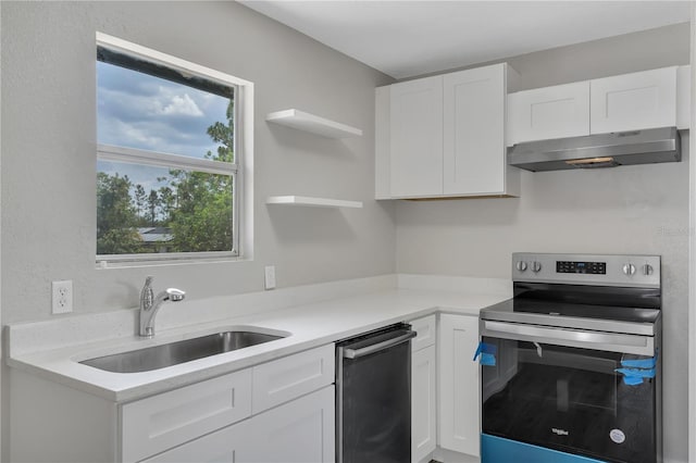 1840 Lillian Dr, Saint Cloud, FL 34771 - kitchen with appliances with stainless steel finishes, under cabinet range hood, a sink, and white cabinets