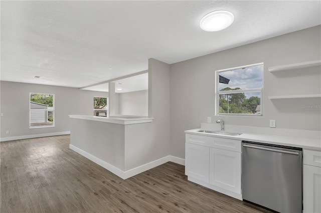1840 Lillian Dr, Saint Cloud, FL 34771 - kitchen featuring stainless steel dishwasher, a sink, light countertops, wood finished floors, and baseboards