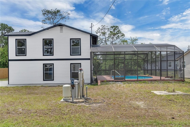 1840 Lillian Dr, Saint Cloud, FL 34771 - rear view of property featuring a lawn and an outdoor pool