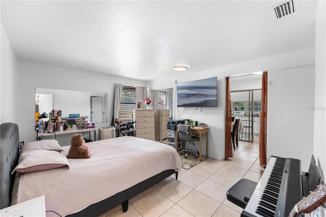 2500 Derby Dr, Kissimmee, FL 34744 - bedroom featuring light tile patterned floors and an office area