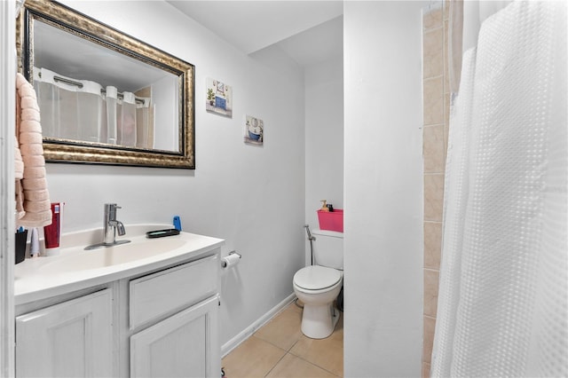 2500 Derby Dr, Kissimmee, FL 34744 - full bathroom with tile patterned floors, toilet, vanity, a shower with shower curtain, and baseboards