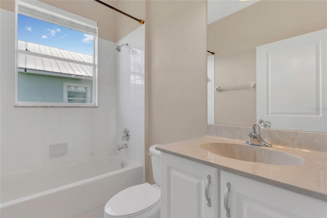bathroom featuring toilet, shower / washtub combination, and vanity