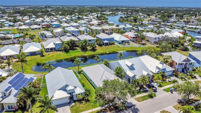 aerial perspective of suburban area featuring a nearby body of water