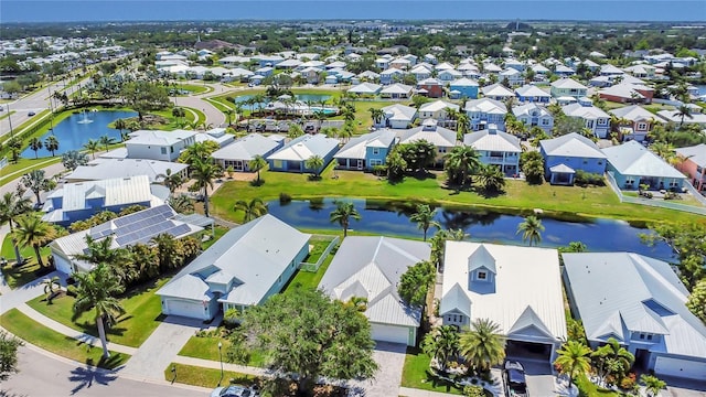 aerial view of residential area featuring a large body of water