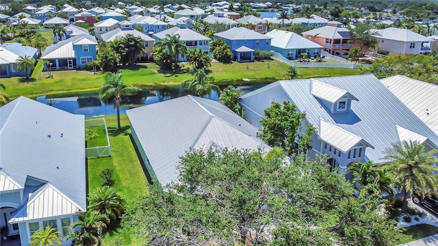 aerial view of residential area with a large body of water