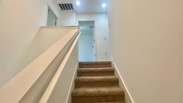 4450 Capital Blvd, Saint Cloud, FL 34769 - stairs featuring baseboards