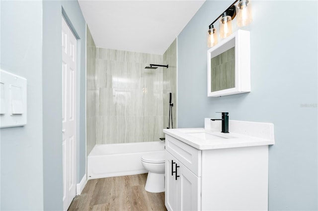 228 Ring Rd, Orlando, FL 32811 - full bathroom with vanity, toilet, shower / bath combination, and wood finished floors