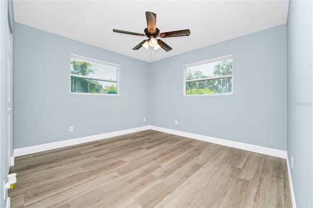 228 Ring Rd, Orlando, FL 32811 - empty room featuring healthy amount of natural light, wood finished floors, and ceiling fan
