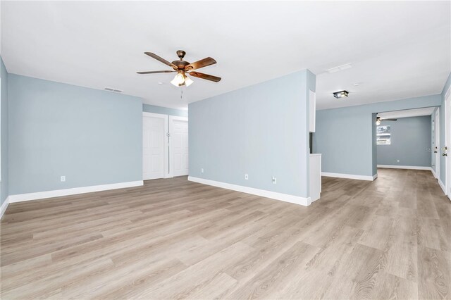228 Ring Rd, Orlando, FL 32811 - empty room featuring a ceiling fan, light wood finished floors, and baseboards