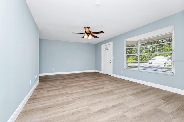 228 Ring Rd, Orlando, FL 32811 - unfurnished room with a ceiling fan, light wood-style flooring, and baseboards