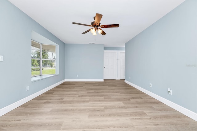 228 Ring Rd, Orlando, FL 32811 - empty room featuring ceiling fan, baseboards, and light wood-style flooring