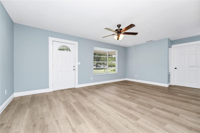 228 Ring Rd, Orlando, FL 32811 - foyer entrance featuring ceiling fan, baseboards, and light wood-type flooring