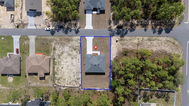 aerial view of property and surrounding area featuring property boundaries highlighted