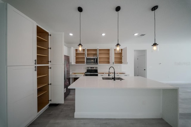 kitchen with open shelves, appliances with stainless steel finishes, a sink, white cabinets, and light countertops