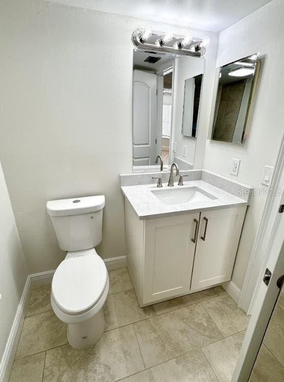 3621 Atrium Dr Unit U-4, Orlando, FL 32822 - bathroom featuring vanity, toilet, and baseboards