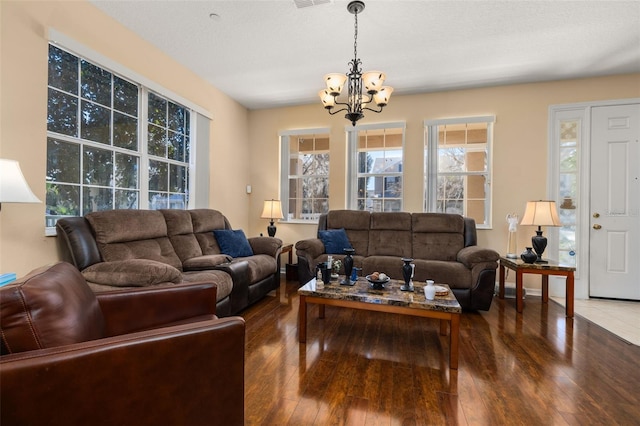 9141 Camden Gardens St, Orlando, FL 32827 - living area featuring a chandelier, healthy amount of natural light, and hardwood / wood-style floors