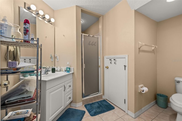 9141 Camden Gardens St, Orlando, FL 32827 - bathroom with toilet, a shower stall, vanity, tile patterned flooring, and baseboards