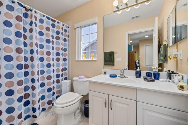 9141 Camden Gardens St, Orlando, FL 32827 - bathroom featuring toilet, vanity, tile patterned floors, and a shower with curtain