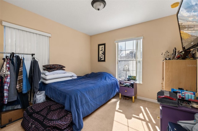 9141 Camden Gardens St, Orlando, FL 32827 - bedroom featuring light colored carpet and baseboards