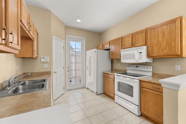 9141 Camden Gardens St, Orlando, FL 32827 - kitchen featuring white appliances, light tile patterned flooring, and light countertops