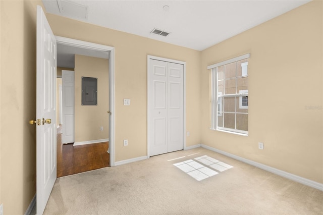 9141 Camden Gardens St, Orlando, FL 32827 - unfurnished bedroom with electric panel, carpet flooring, and a closet
