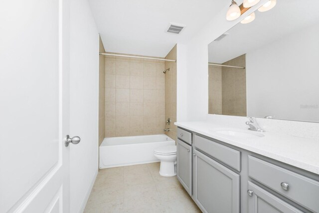 809 Benoi Dr, Davenport, FL 33896 - full bath featuring vanity, toilet, shower / bathtub combination, and tile patterned floors