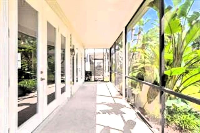 unfurnished sunroom with healthy amount of natural light