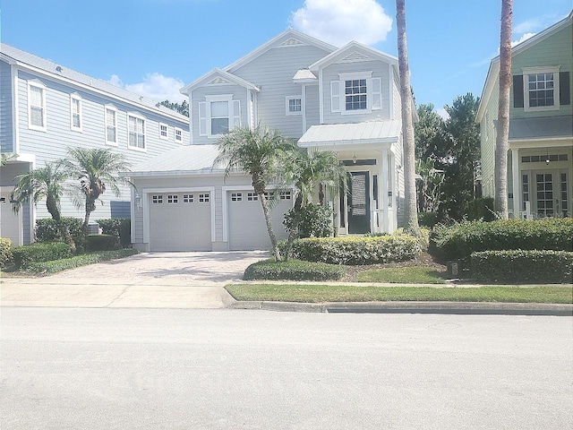 view of front of property with an attached garage and concrete driveway