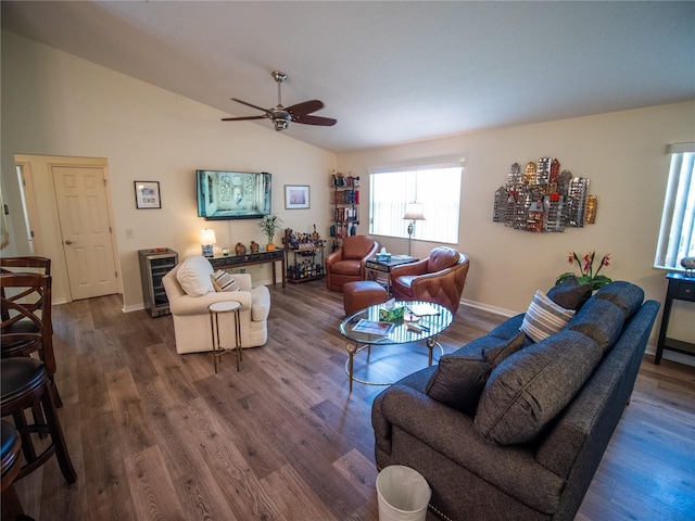 2167 Kerwood Loop, The Villages, FL 32162 - living room with dark wood-style floors, ceiling fan, vaulted ceiling, baseboards, and wine cooler