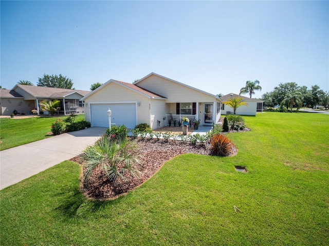 2167 Kerwood Loop, The Villages, FL 32162 - single story home with a garage, a porch, driveway, and a front lawn