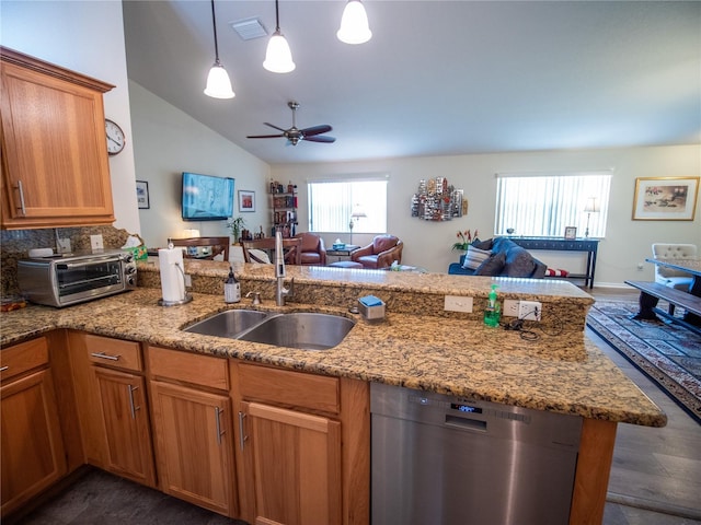2167 Kerwood Loop, The Villages, FL 32162 - kitchen with stainless steel dishwasher, open floor plan, a sink, a ceiling fan, and light stone counters