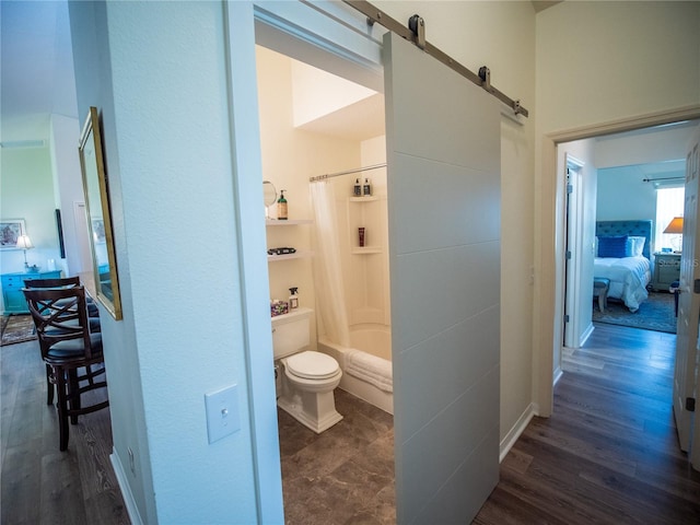 2167 Kerwood Loop, The Villages, FL 32162 - ensuite bathroom with shower / bath combo, wood finished floors, and toilet
