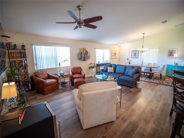 2167 Kerwood Loop, The Villages, FL 32162 - living area with ceiling fan, wood finished floors, a chandelier, and vaulted ceiling