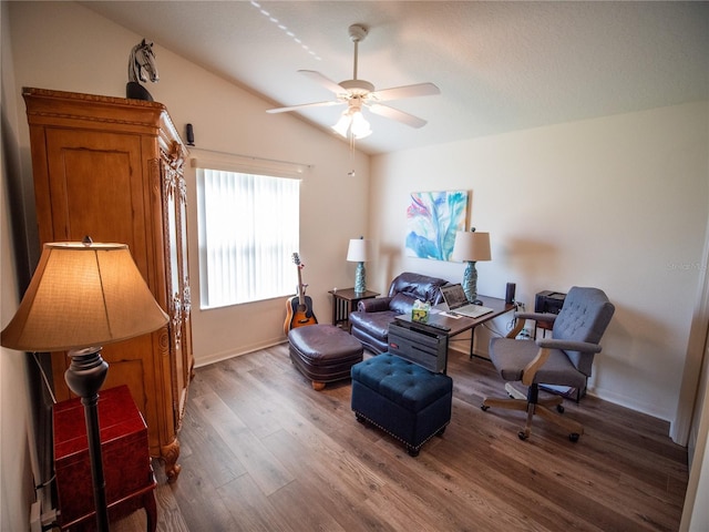 2167 Kerwood Loop, The Villages, FL 32162 - sitting room with vaulted ceiling, ceiling fan, wood finished floors, and baseboards