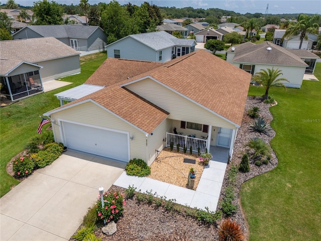 2167 Kerwood Loop, The Villages, FL 32162 - view of front of house with roof with shingles, a residential view, covered porch, and a garage