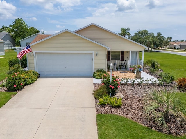 2167 Kerwood Loop, The Villages, FL 32162 - ranch-style house featuring a porch, an attached garage, a front yard, and concrete driveway
