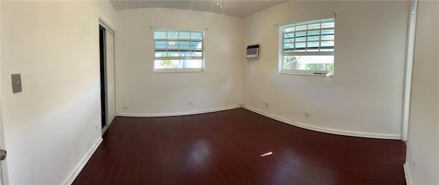 2411 SW 50th Ter, Plantation, FL 33317 - unfurnished room with baseboards, plenty of natural light, wood finished floors, and heating unit