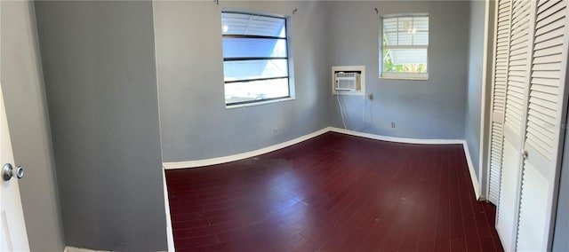 2411 SW 50th Ter, Plantation, FL 33317 - spare room with baseboards, wood finished floors, and a wall mounted AC