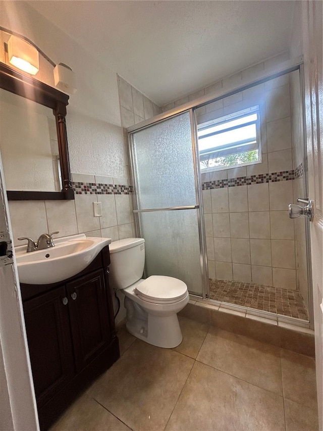 2411 SW 50th Ter, Plantation, FL 33317 - full bathroom featuring toilet, a stall shower, vanity, tile patterned flooring, and tile walls