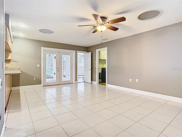 148 Tarrytown Trl, Longwood, FL 32750 - empty room with french doors, ceiling fan, baseboards, and light tile patterned floors