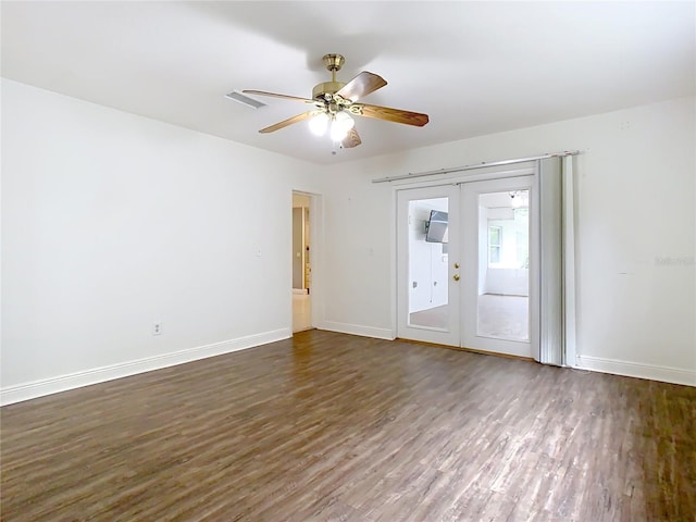 148 Tarrytown Trl, Longwood, FL 32750 - spare room with dark wood-style flooring, baseboards, and a ceiling fan