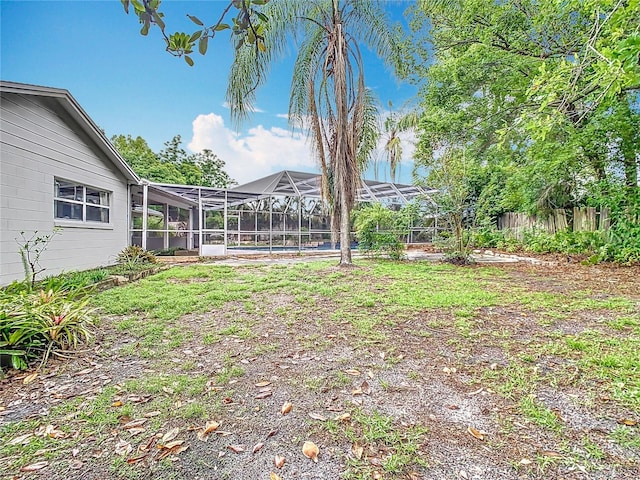 148 Tarrytown Trl, Longwood, FL 32750 - view of yard featuring glass enclosure and fence